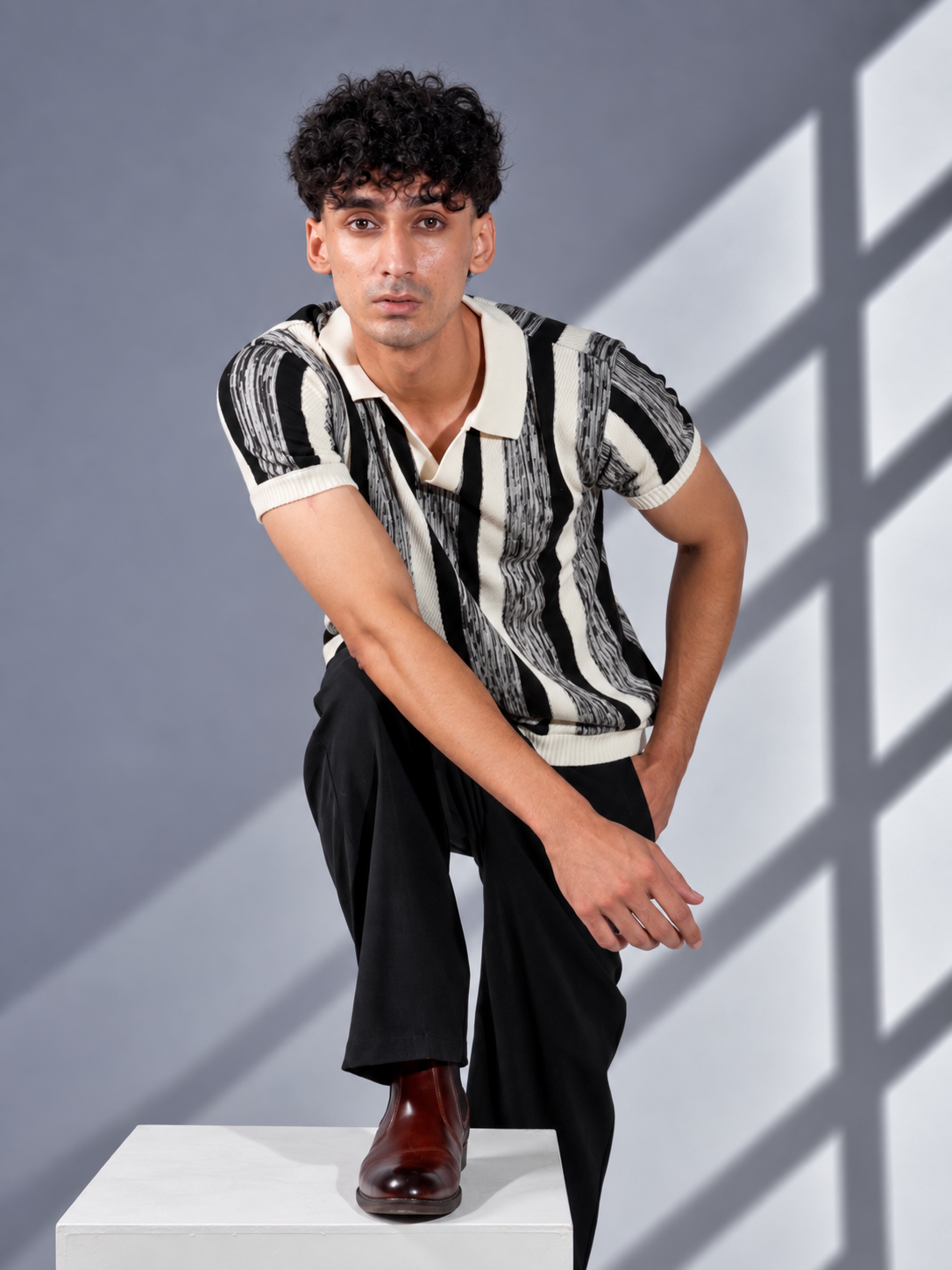 BLACK MELANGÉ KNIT POLO